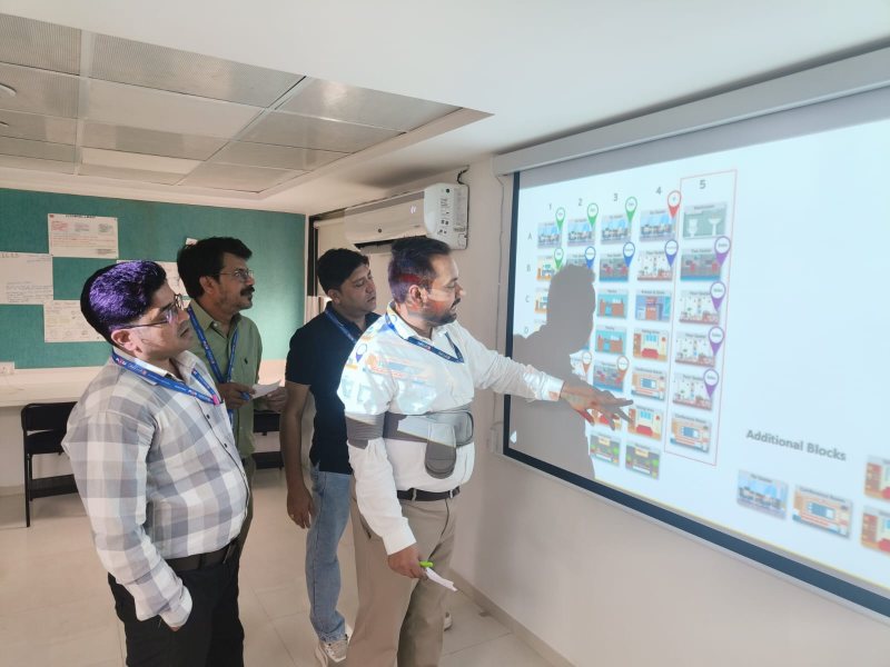 Participants reviewing an activity on screen